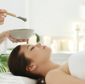 A client receiving a full body massage in a serene spa setting, emphasizing relaxation and certified care in Islamabad.