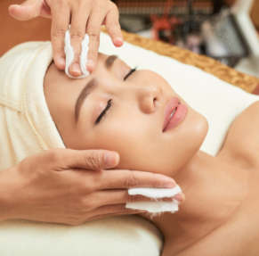 A female client lying comfortably during a back massage session, representing relaxation and positive feedback at our massage center in Islamabad.